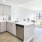a kitchen with white cabinets