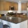 a kitchen with a bar and a refrigerator