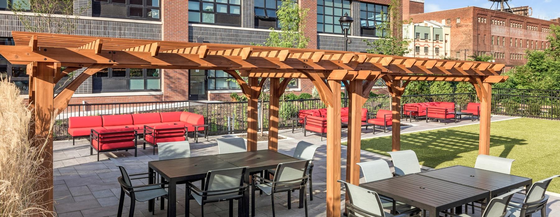 a patio with tables and chairs