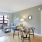 a living room with a table and chairs