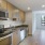 a kitchen with wooden cabinets