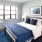 a bedroom with a bed and a desk