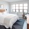 a bedroom with a bed and a desk
